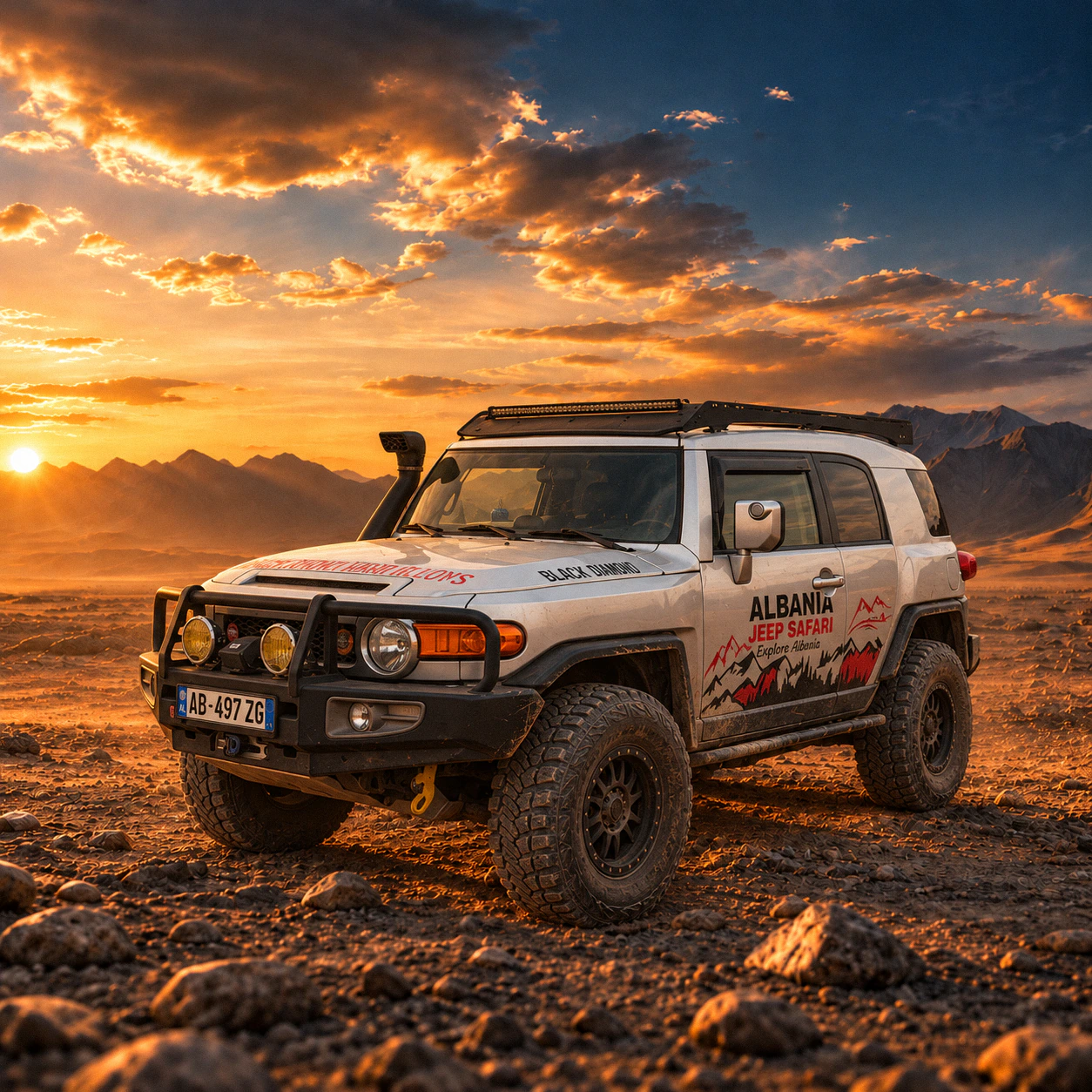 Albania Jeep Safari's white Toyota FJ Cruiser on a rocky plain at sunset