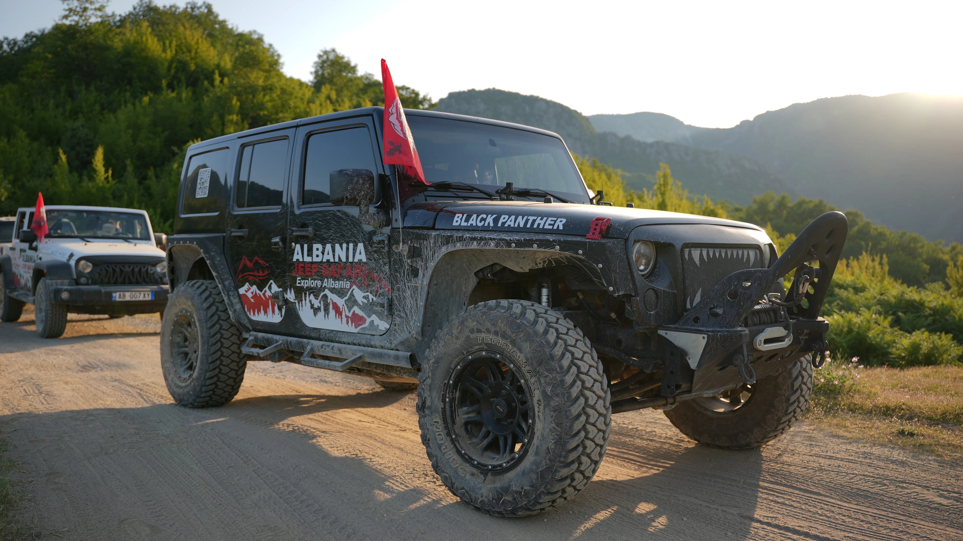 The Black Panther Wrangler on the track above the valley, flag flying