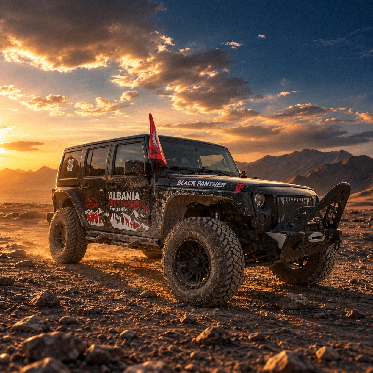 Black Panther, a black Jeep Wrangler in Albania Jeep Safari livery, on a rocky plain at sunset